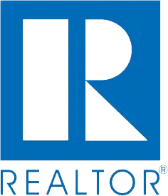 A blue and green logo for realtor. Com